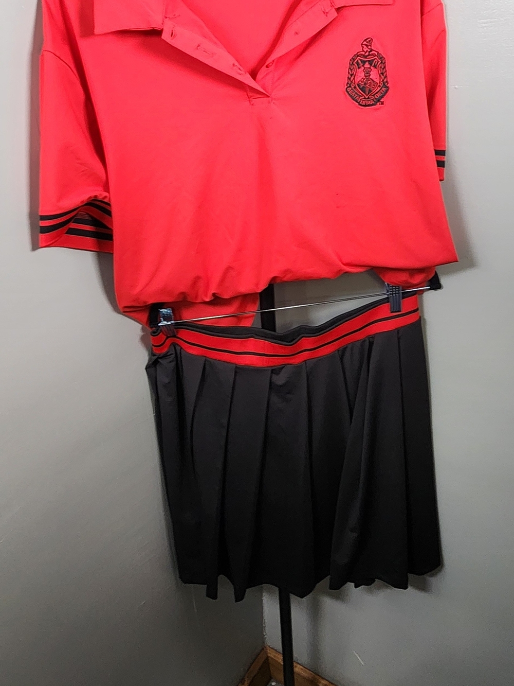Women’s Pink Polo Top and Black Pleated Skirt Set - Classic Athletic Style